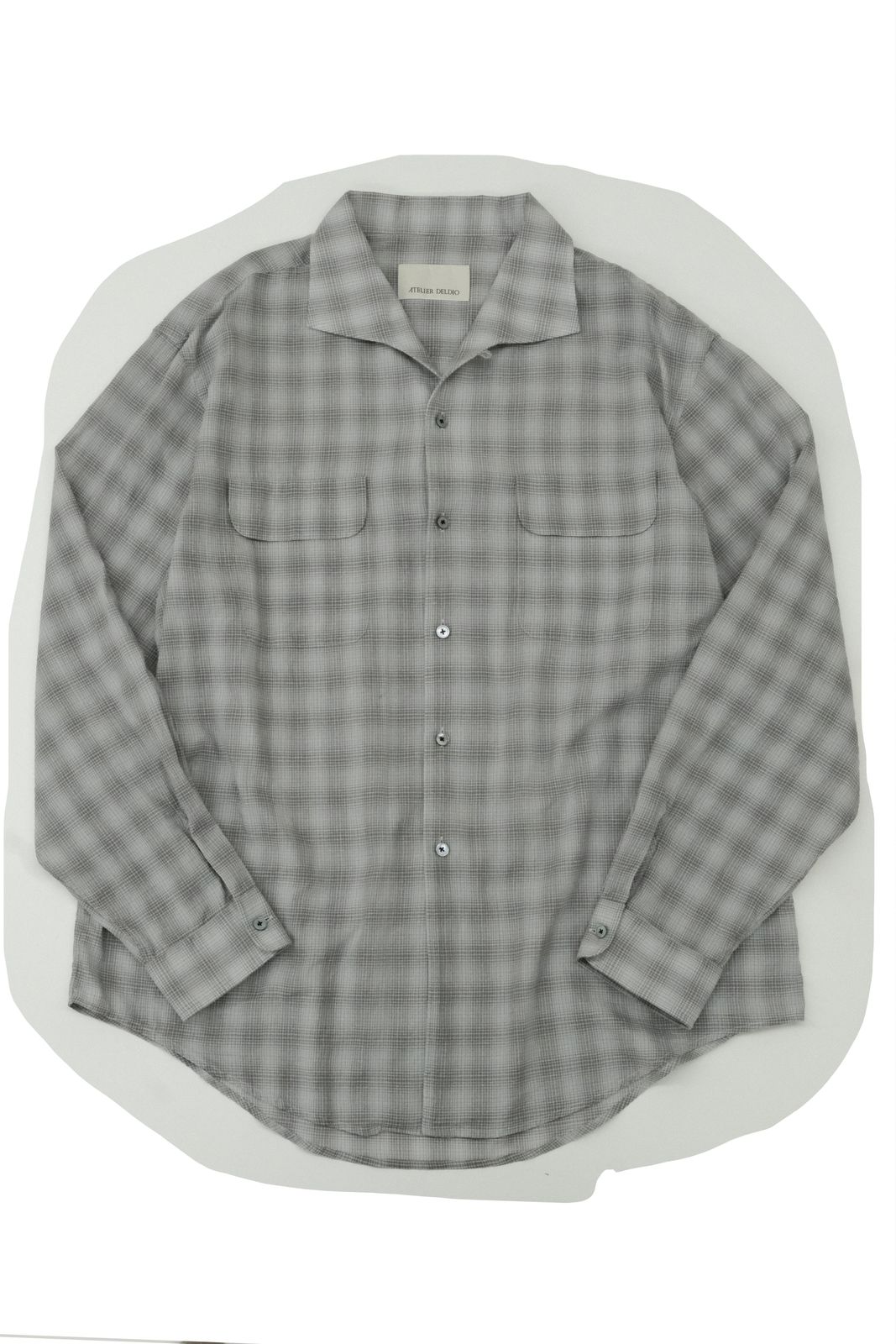 a gray and white checkered shirt on a white background