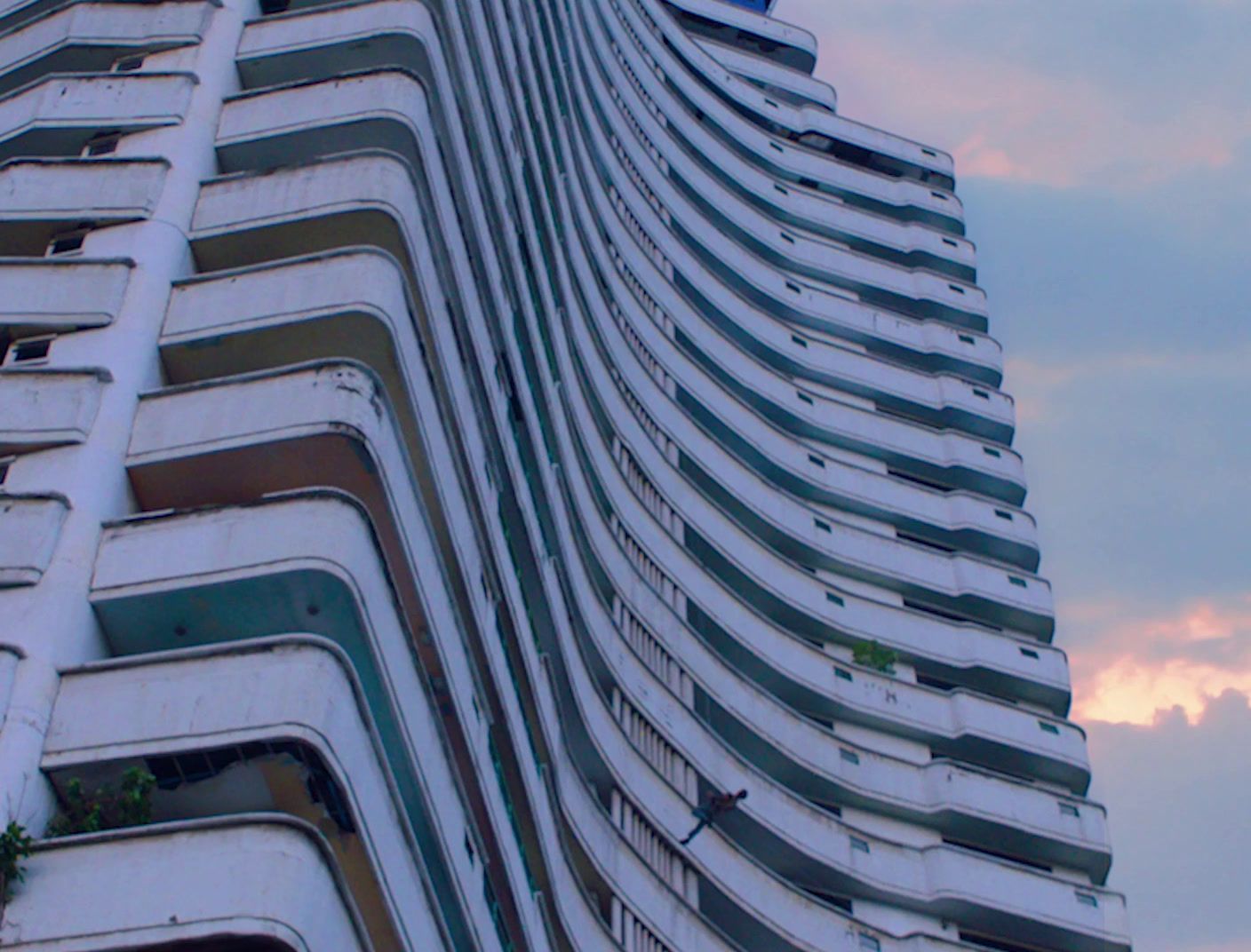 a very tall building with a sky background