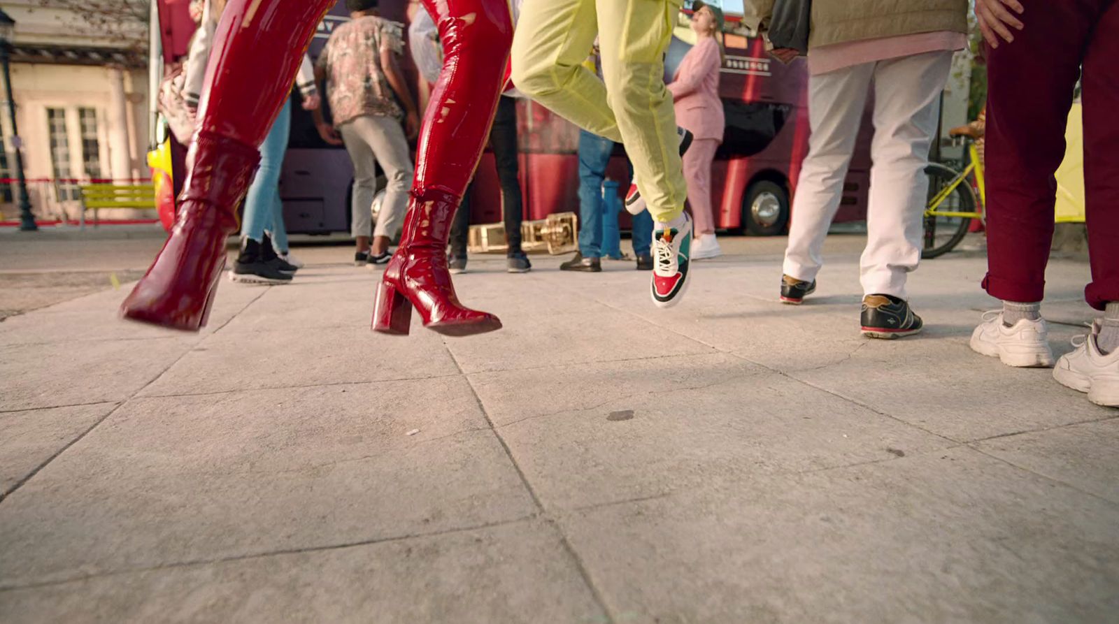 a group of people standing on a sidewalk