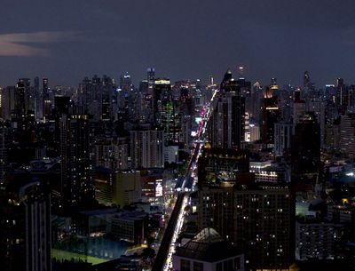 a city at night with a very long line of traffic