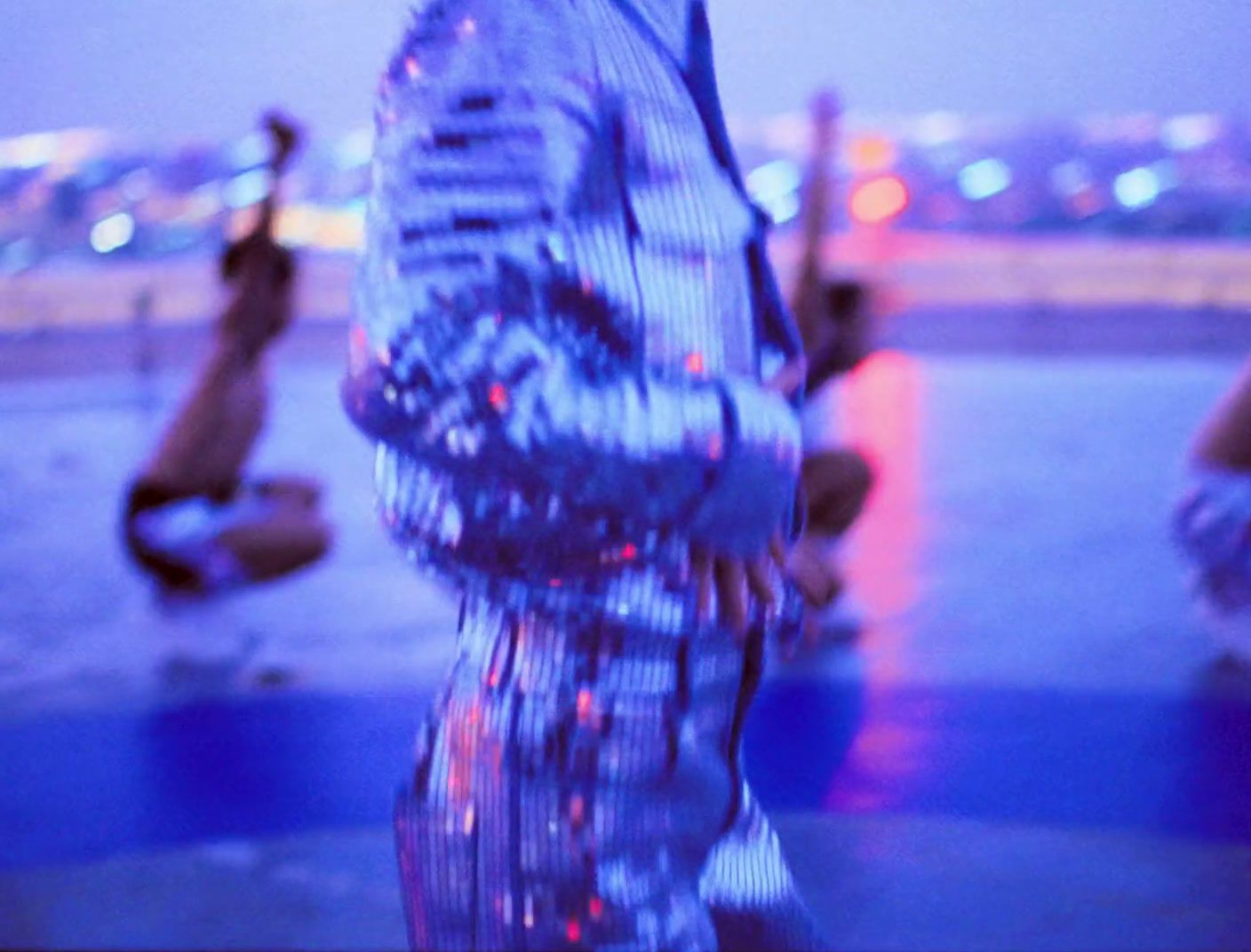 a man standing in front of a body of water