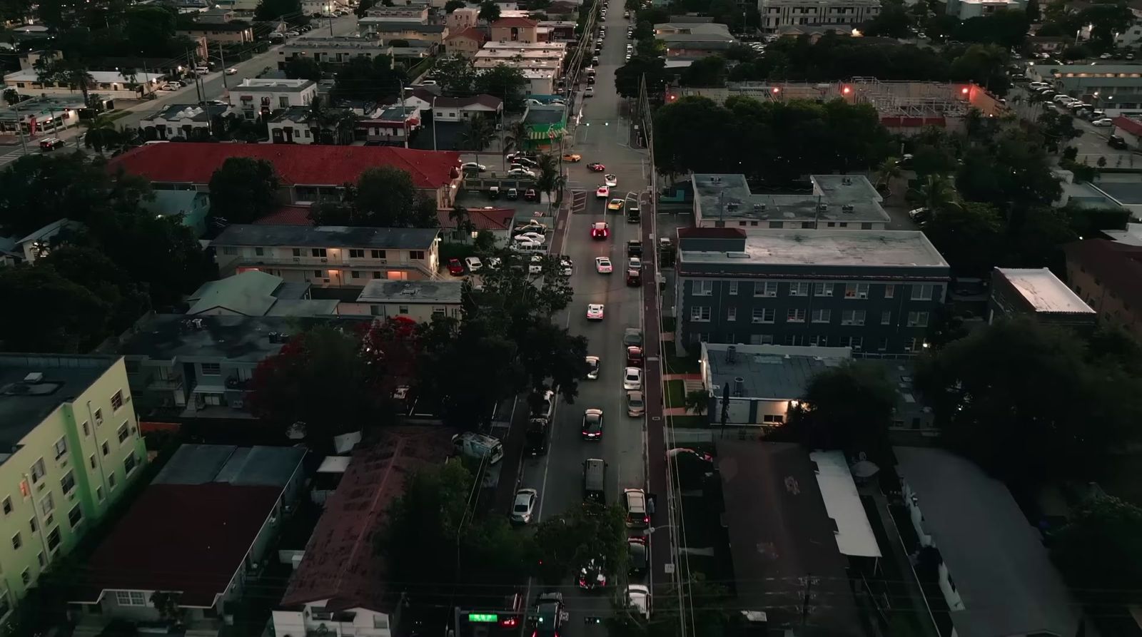 an aerial view of a city at dusk