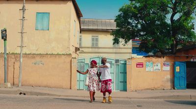 a couple of people that are standing in the street