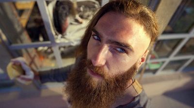 a man with a long beard and blue eyes