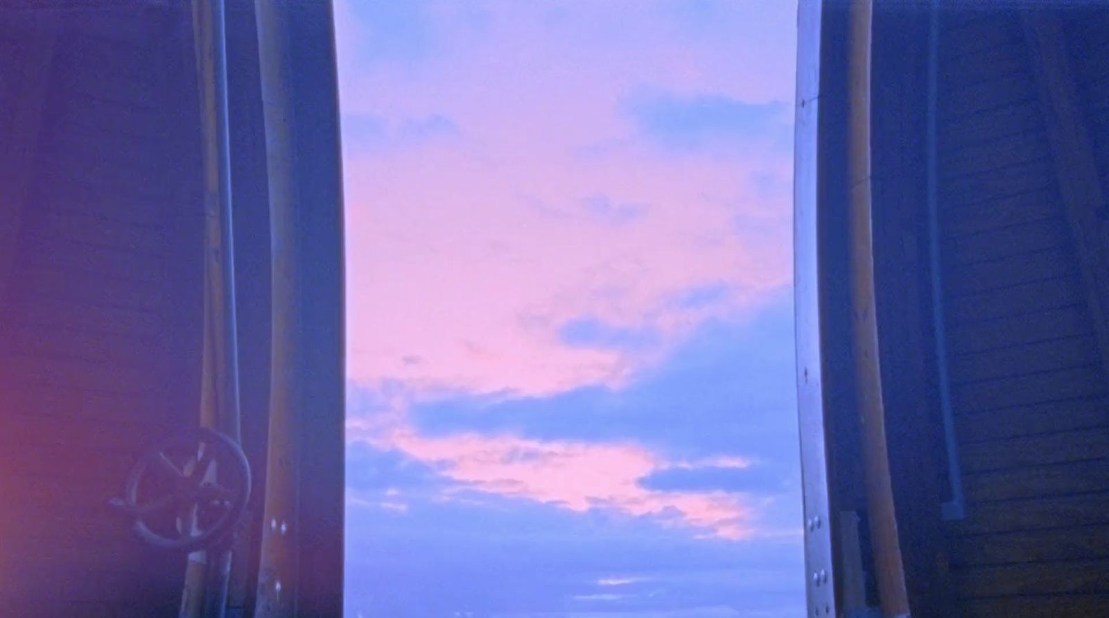 a view of the sky through two windows