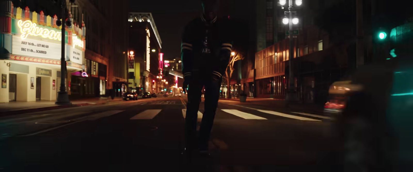 a blurry photo of a city street at night