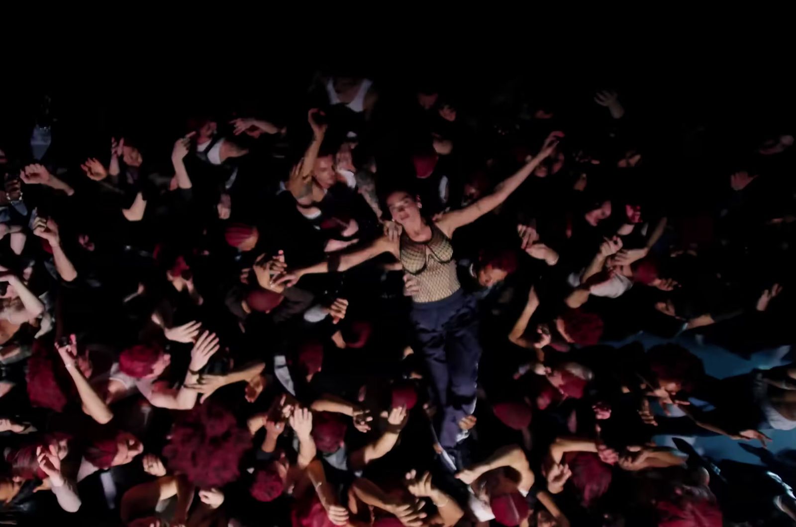 a large group of people in a dark room