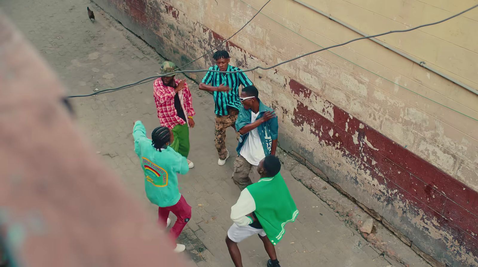 a group of young men walking down a street