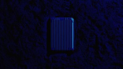 a blue case sitting on top of a black surface