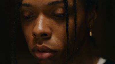 a close up of a person with dreadlocks