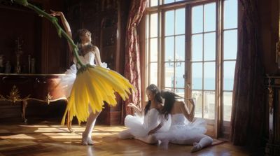 a woman in a white dress and a woman in a yellow dress