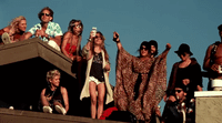 a group of people standing on top of a roof