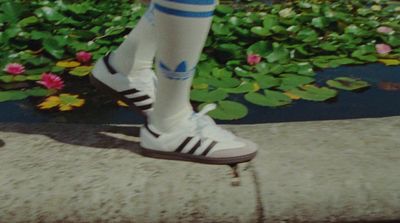 a person wearing white and blue socks and socks