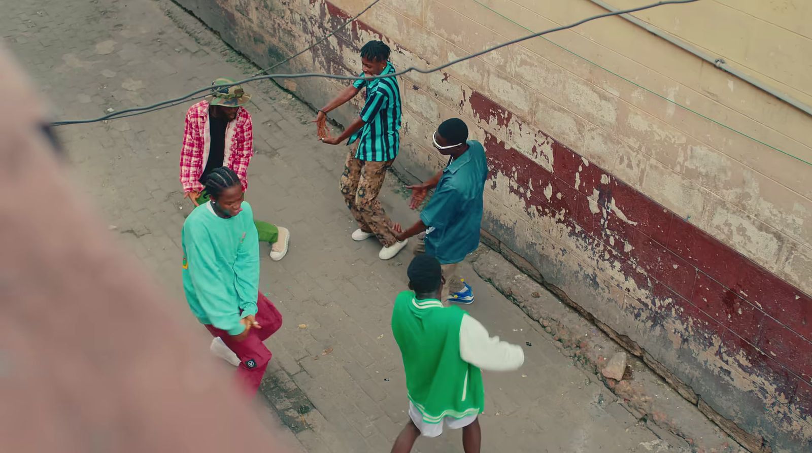 a group of people walking down a street