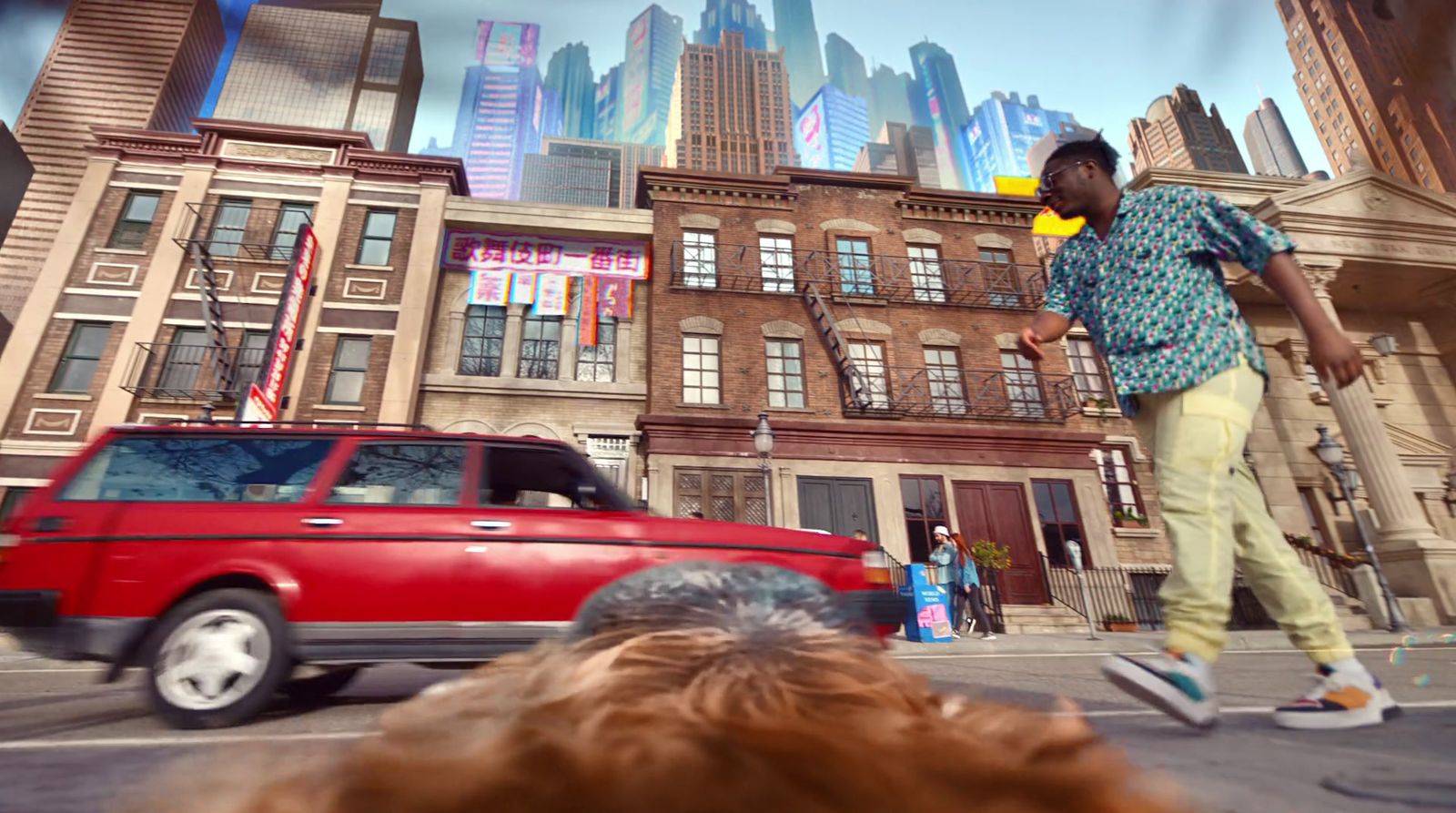 a man riding a skateboard down a street next to a red car