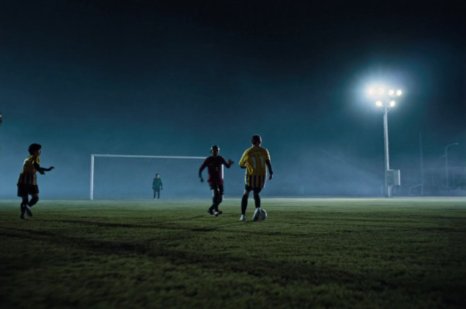 a group of young men playing a game of soccer