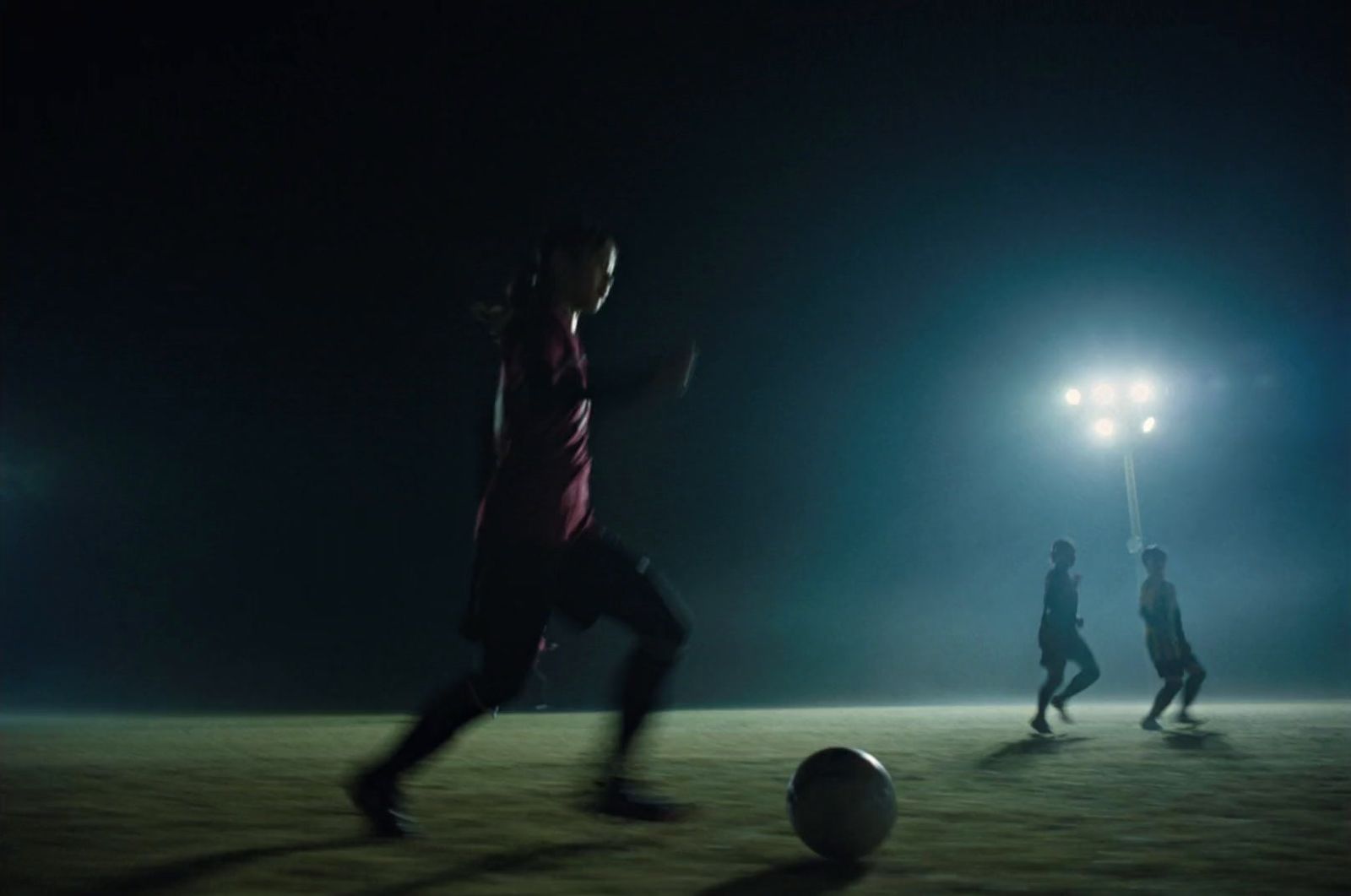 a group of people playing a game of soccer