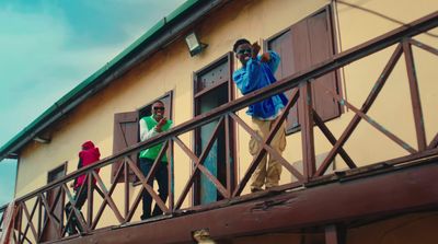 a group of people standing outside of a building