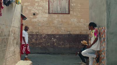 a couple of people sitting on a wall