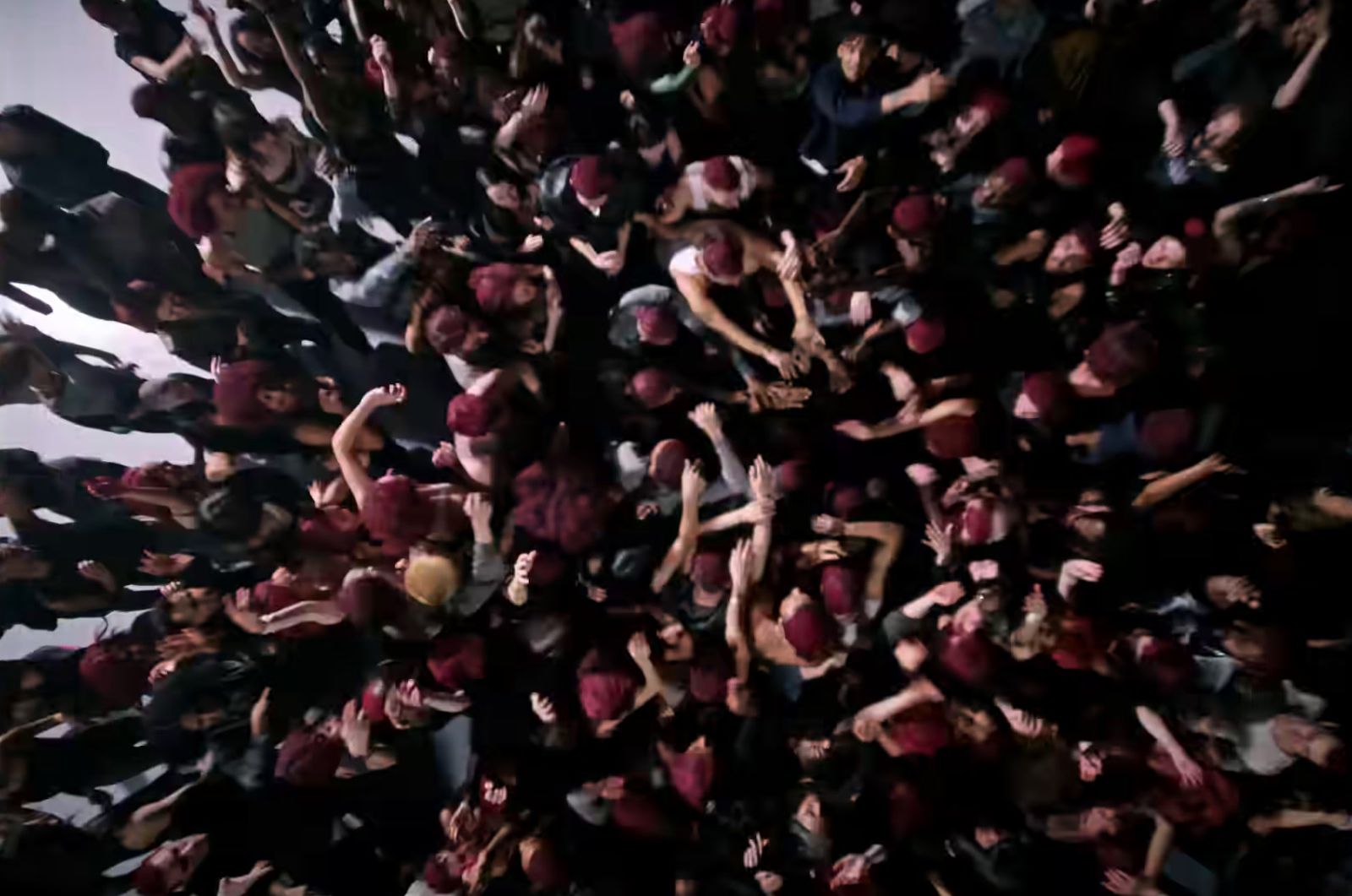 a large group of people standing in the air