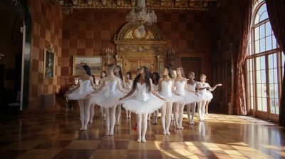 a group of ballerinas standing in a room