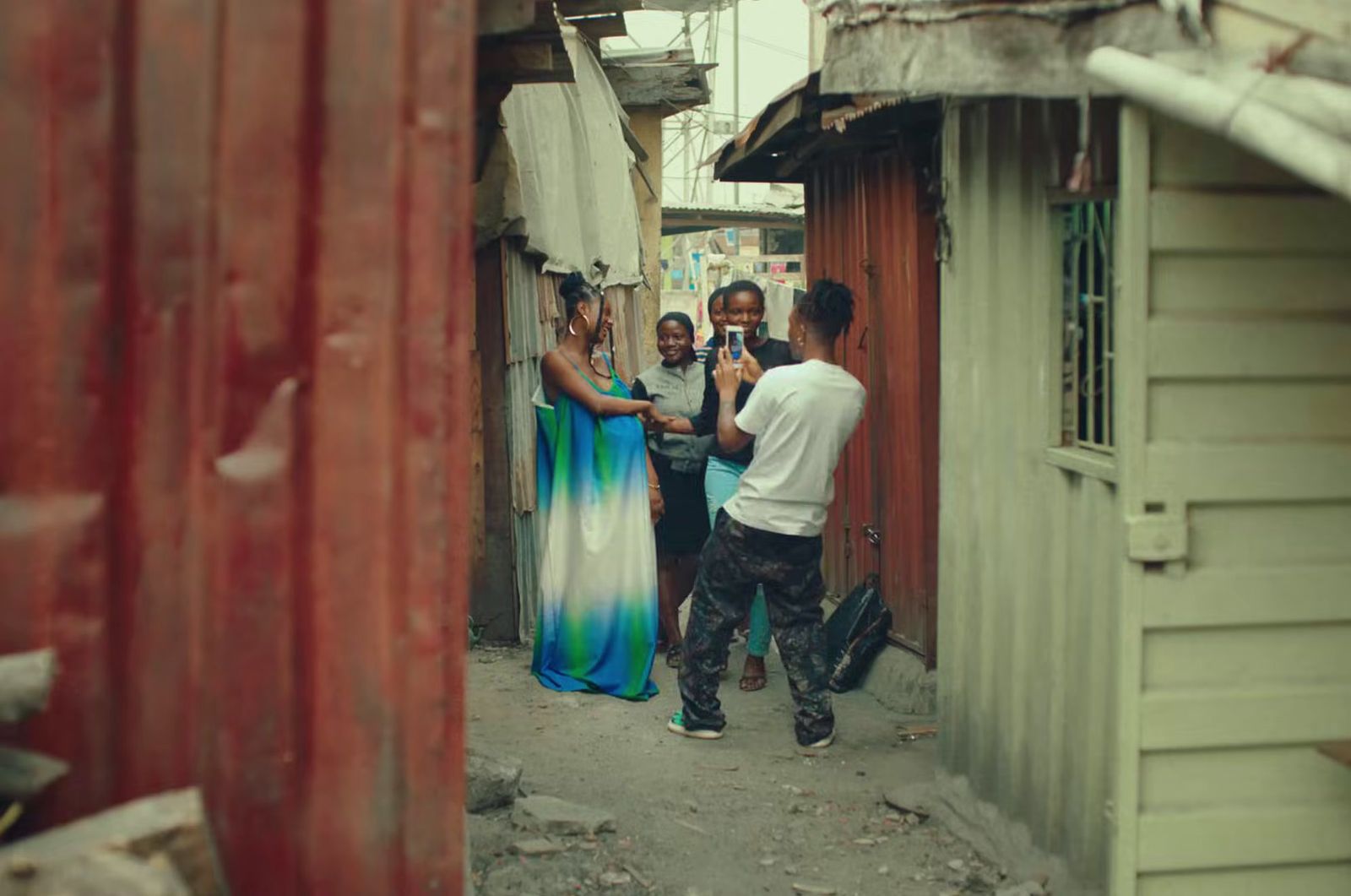 a group of people standing outside of a building