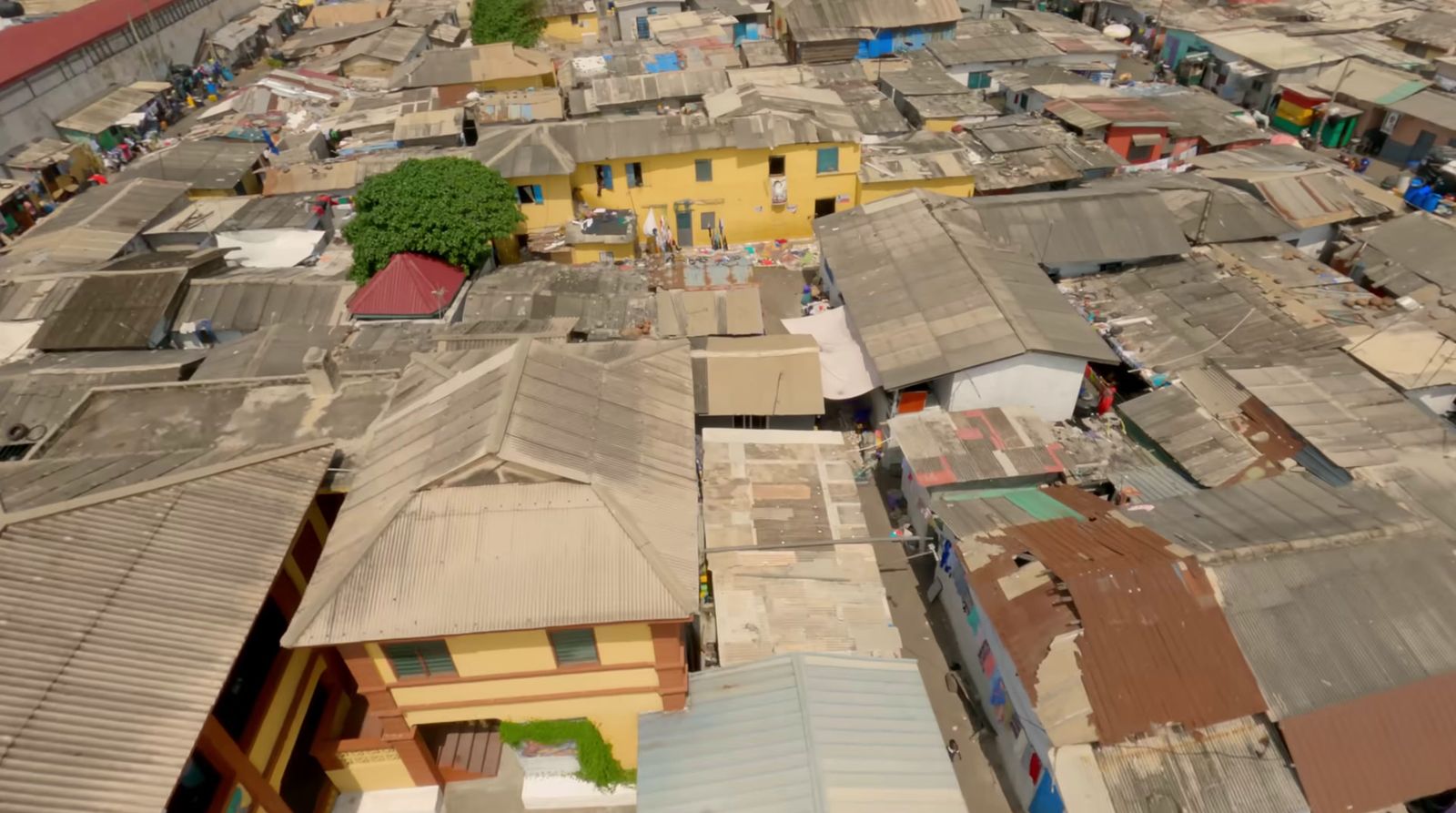 an aerial view of a city with many roofs