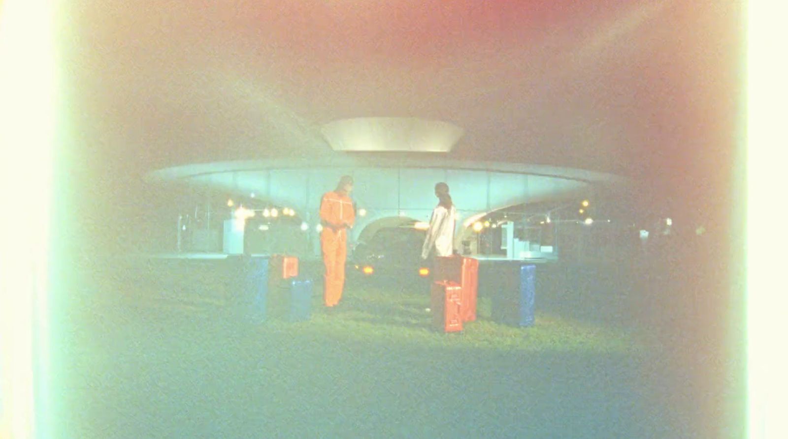 a couple of people standing in front of a building