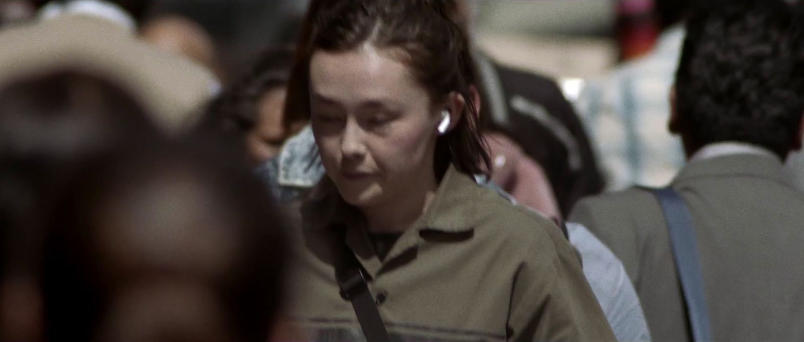 a woman with ear buds on her ears