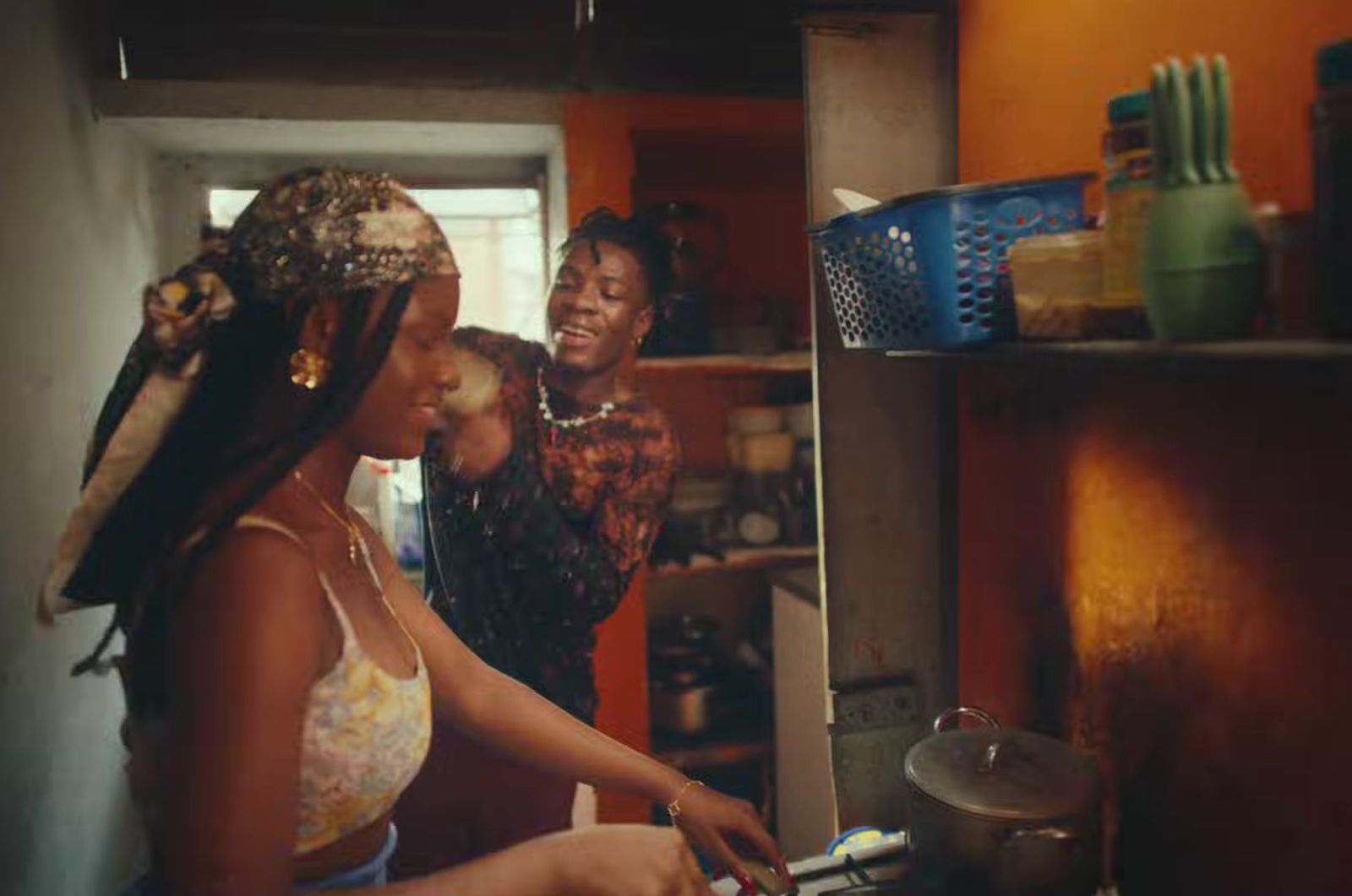 a group of women standing in a kitchen preparing food