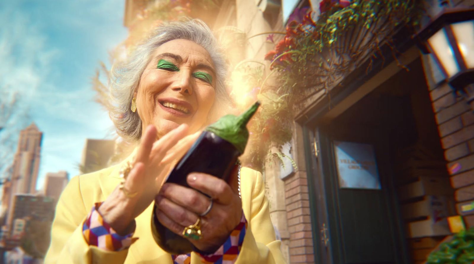 an older woman holding a bottle of wine