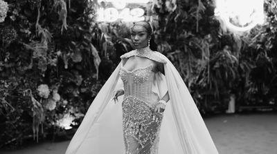 a black and white photo of a woman in a wedding dress