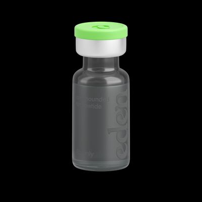a small bottle with a green lid on a black background