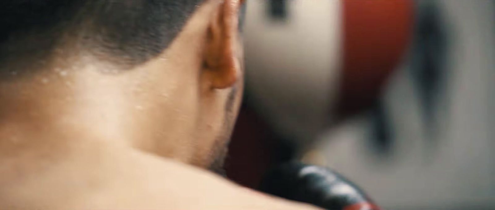 a man getting his hair cut by a barber