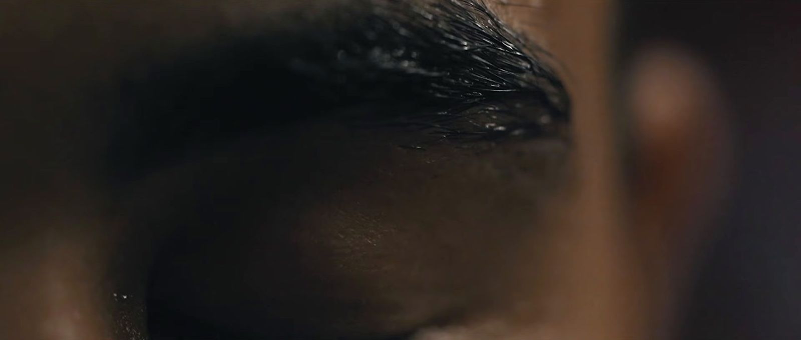 a close up of a person's eye with a blurry background