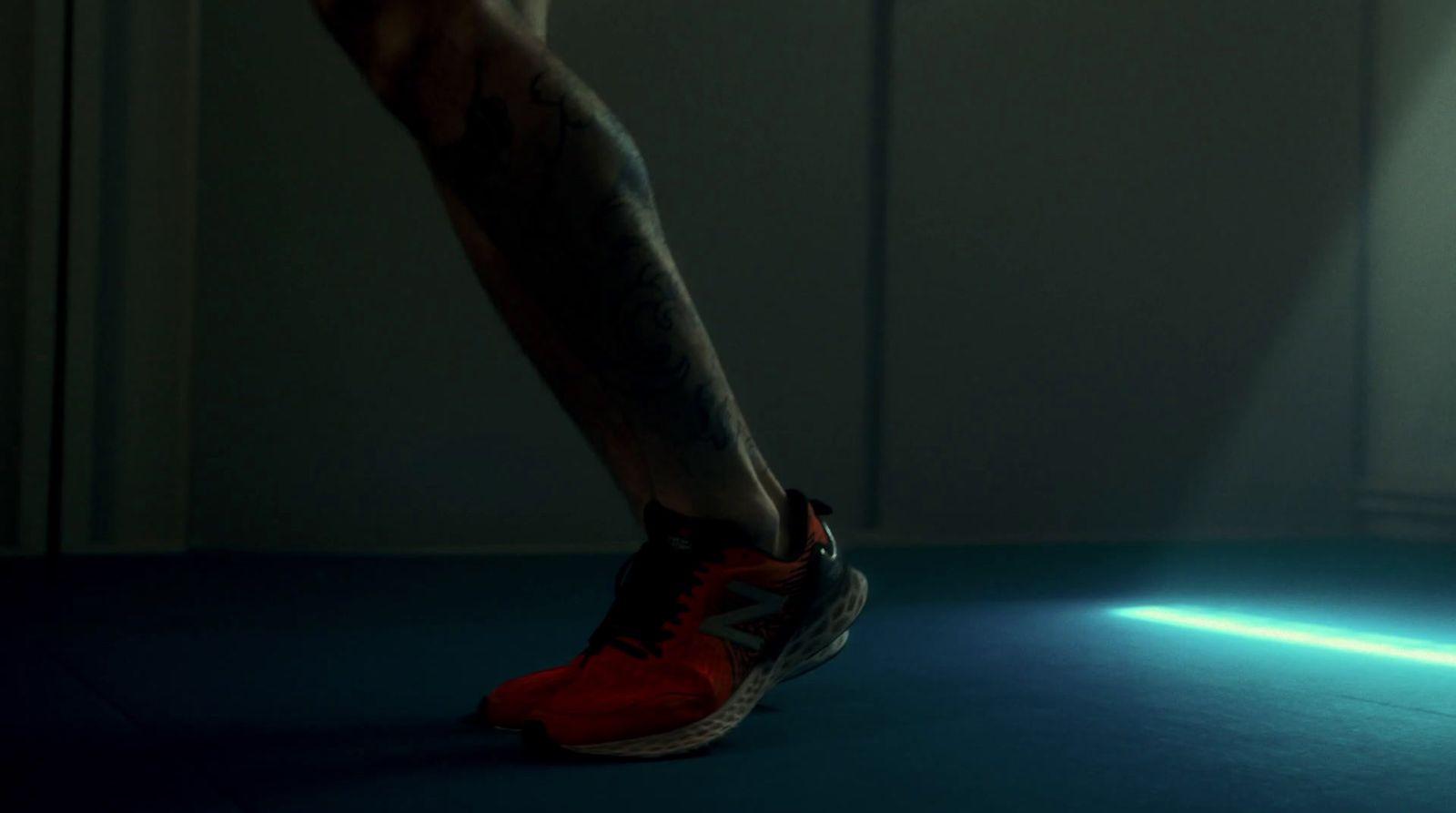 a man's legs and leg with a light shining on them