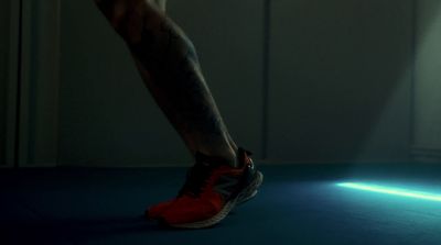 a man's legs and leg with a light shining on them