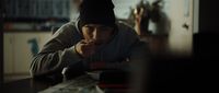 a man sitting at a table eating food