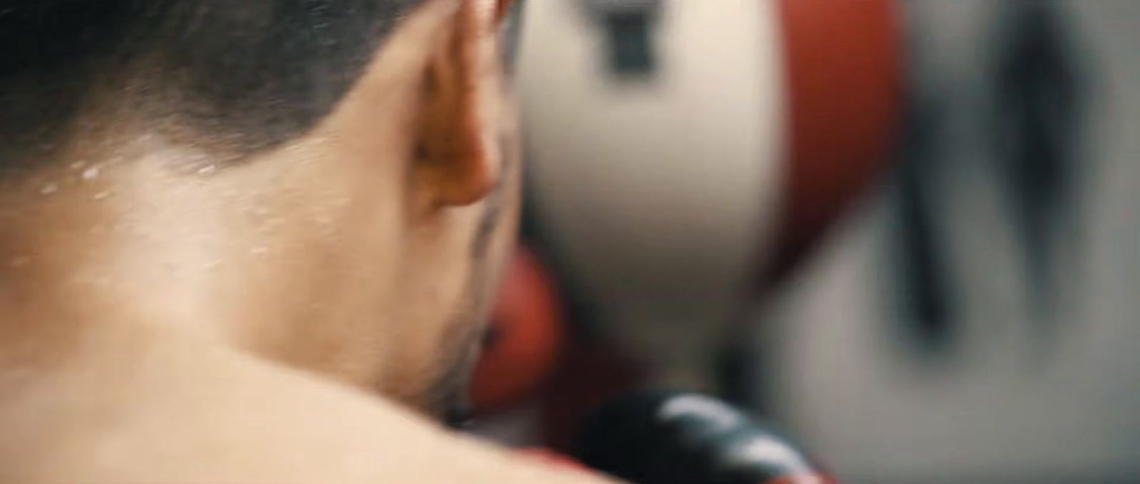 a close up of a person with a hair dryer