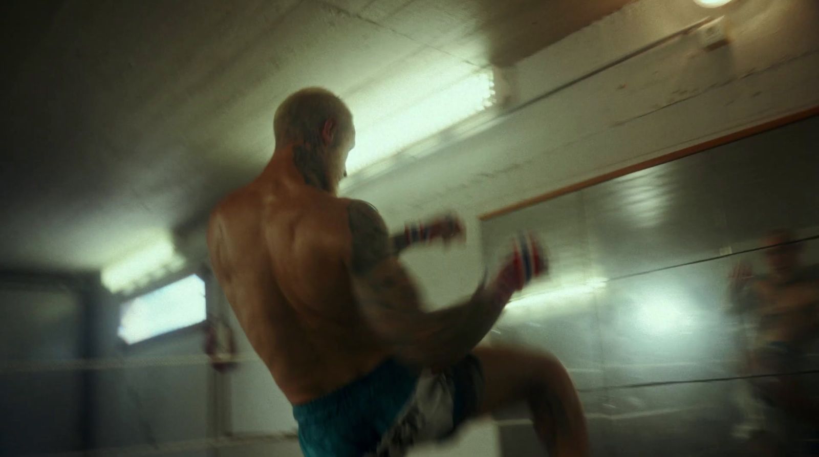 a blurry photo of a man in a boxing ring