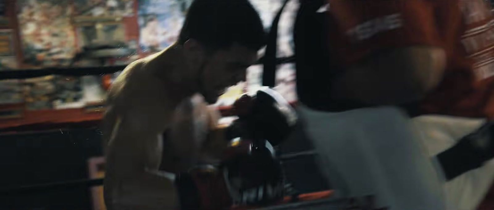 a blurry image of a shirtless man in a store