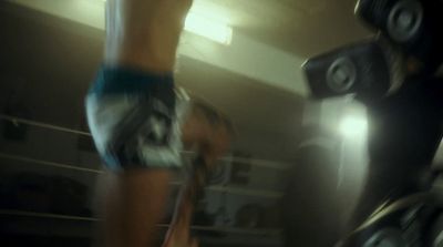 a blurry photo of a person in a boxing ring