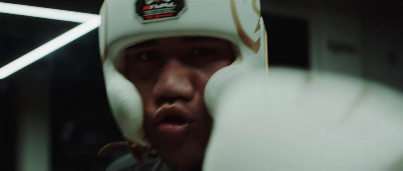 a close up of a person wearing boxing gloves