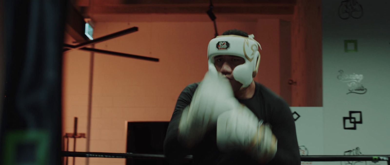 a man wearing a white mask and boxing gloves