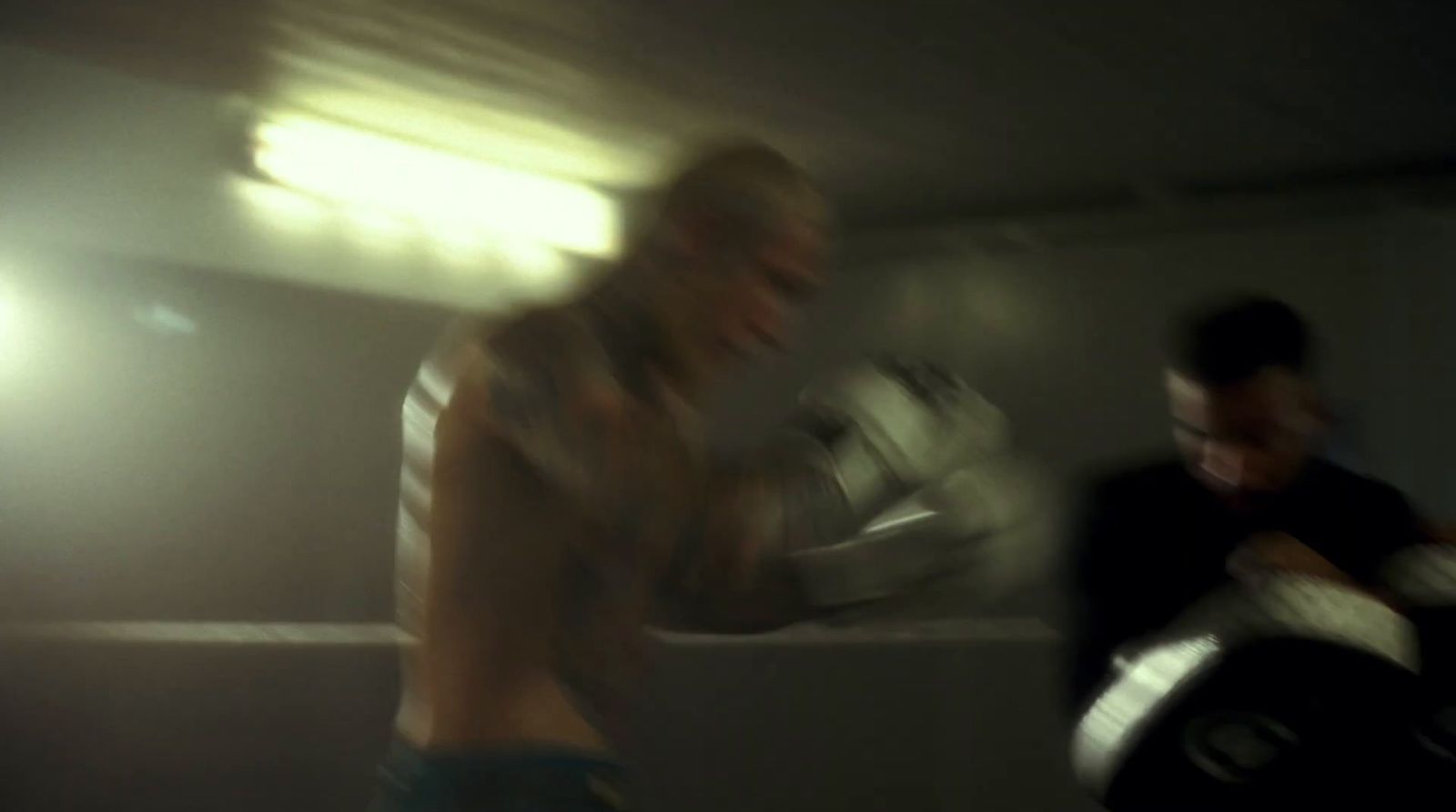 a blurry photo of two men in a room