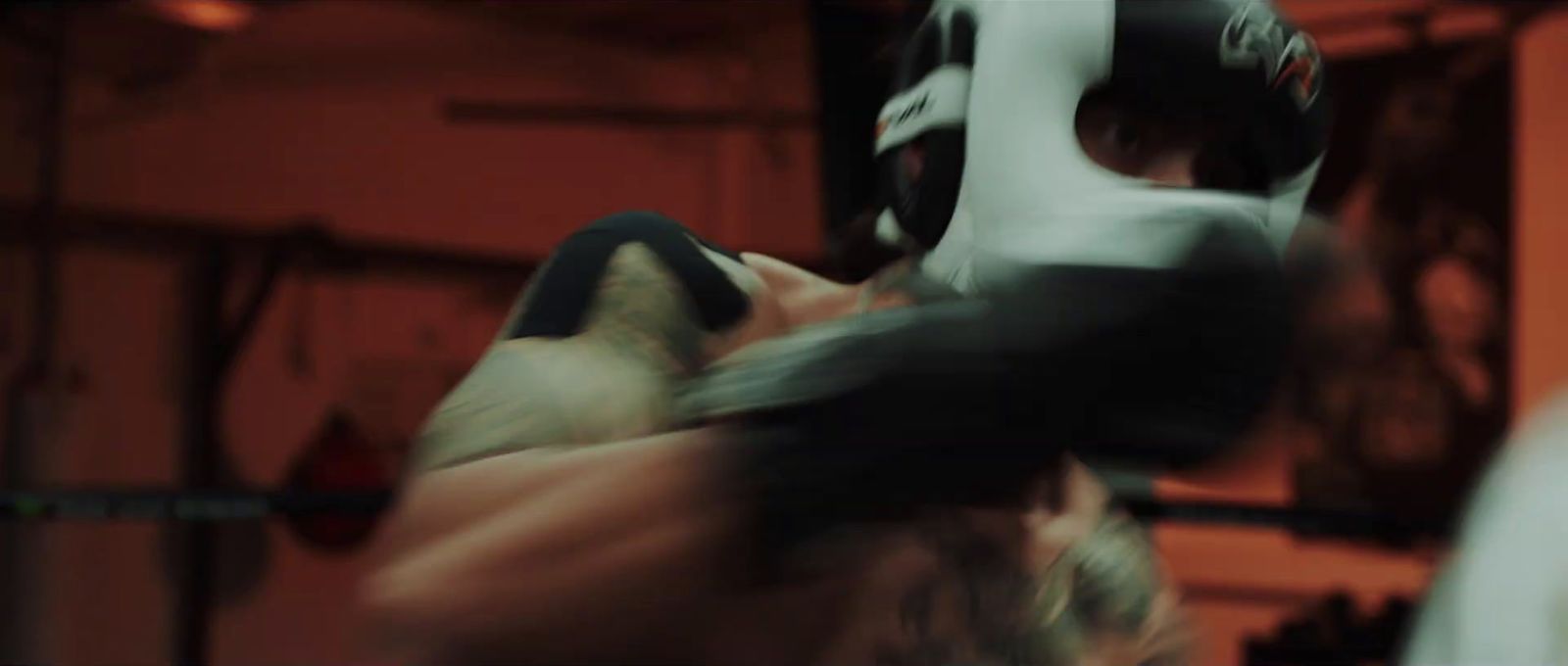 a blurry photo of a man in a boxing ring