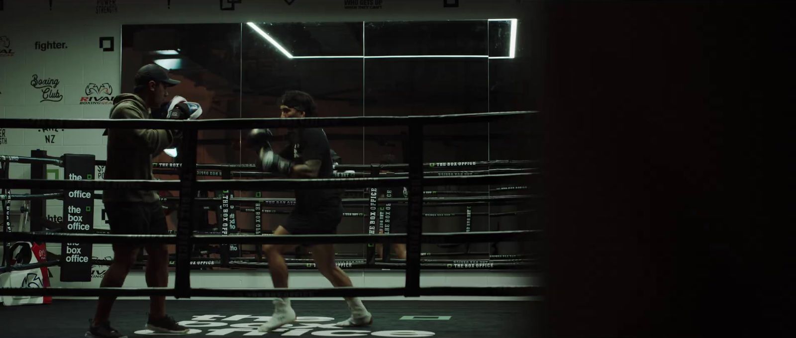 a couple of people in a boxing ring