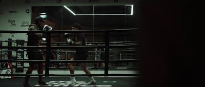 a couple of people in a boxing ring