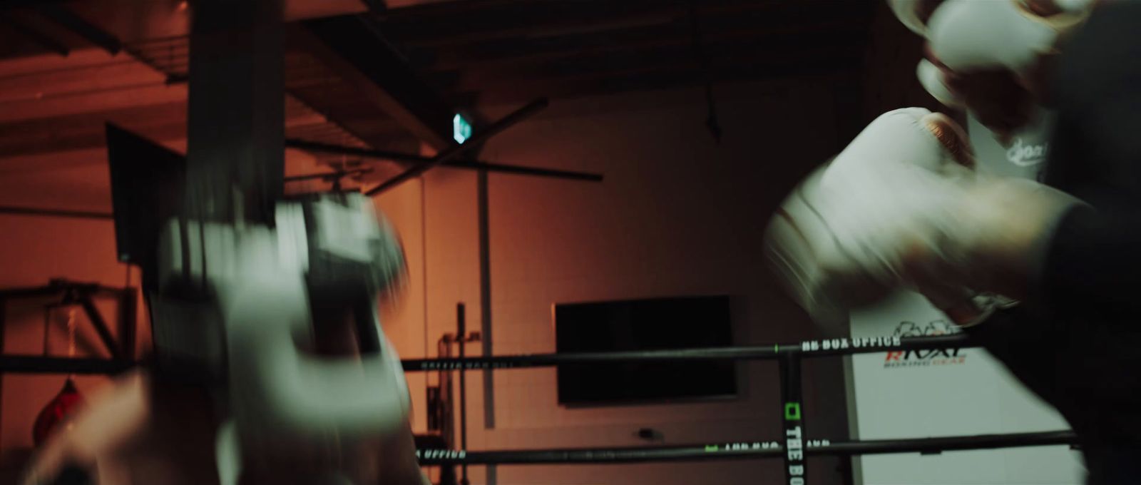 a blurry photo of a person in a boxing ring