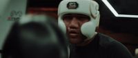 a man wearing a white boxing head guard